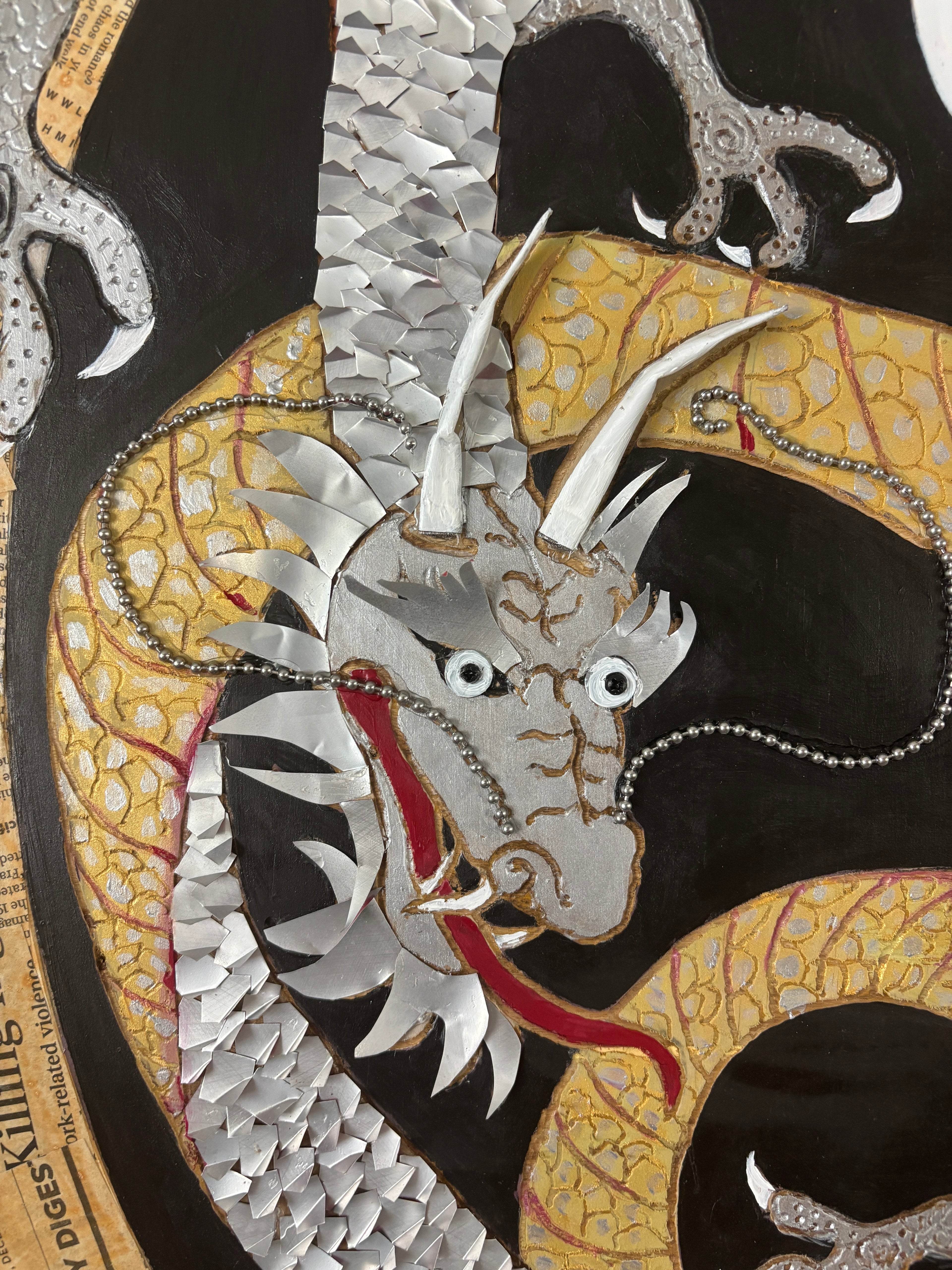 Balance of Life — detail of Coca-Cola can dragon scales on carved wood by Rita Irvin