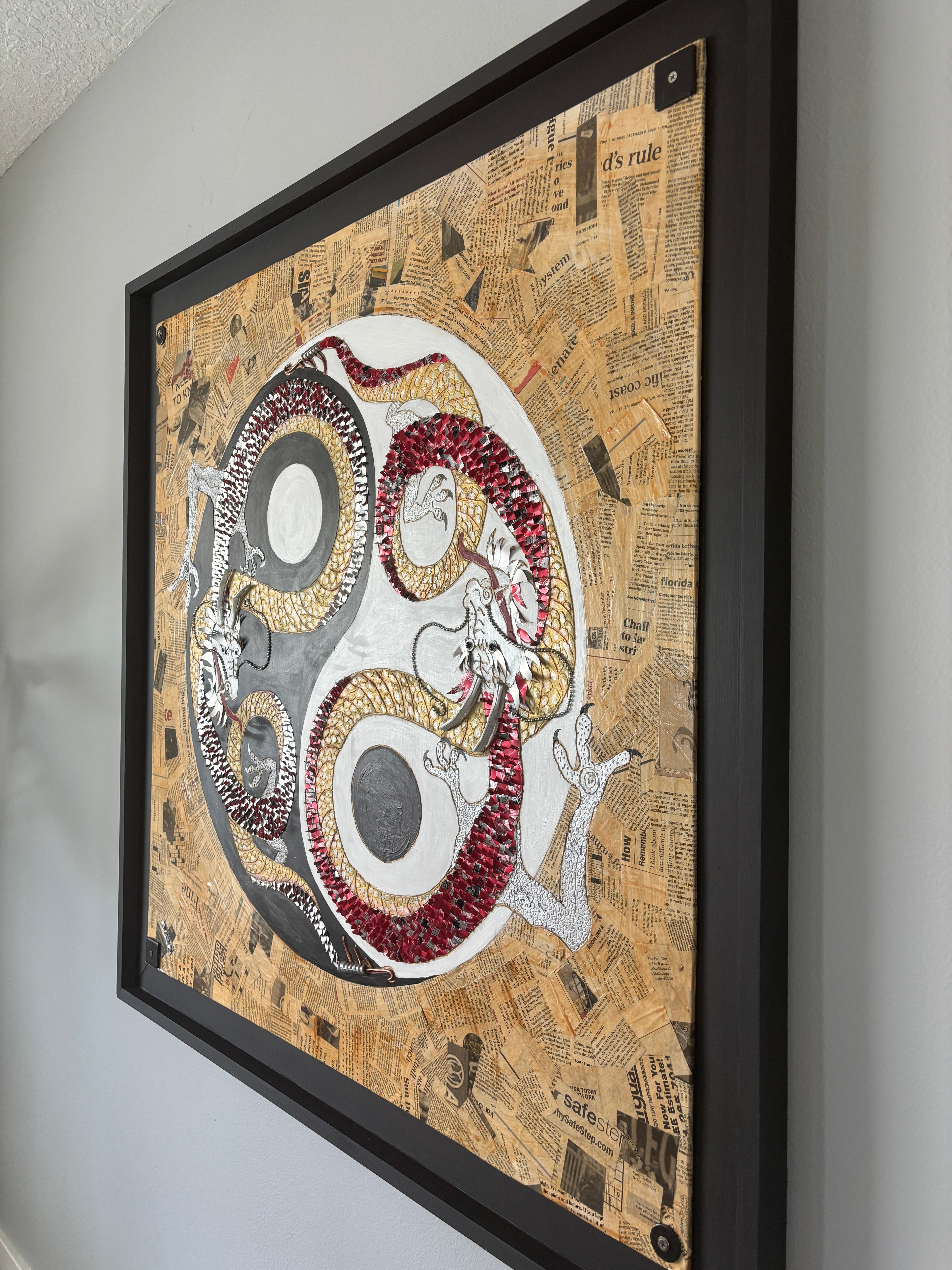 Balance of Life — angled wall view of framed mixed media dragon painting by Rita Irvin