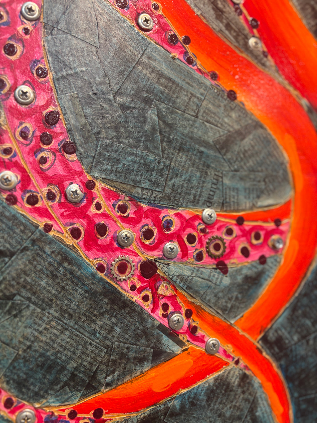 Octavia — detail of newspaper collage background and OCTAVIA name plate on wood by Rita Irvin